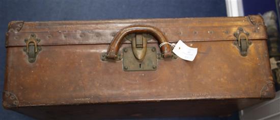 A Louis Vuitton leather suitcase, 26 x 16.5 x 8.5in.